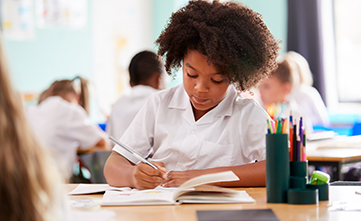 young black student taking a general reasoning school test